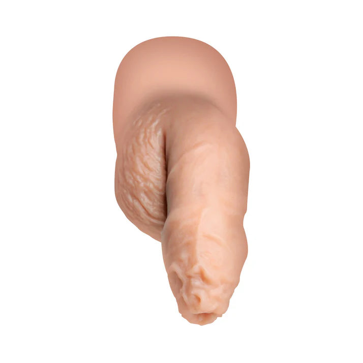 Close-up view of the Strap U 5.1 in. Uncut Silicone Packer Dildo highlighting its soft and pliable silicone material, ideal as an uncut silicone dildo for comfort and confidence.